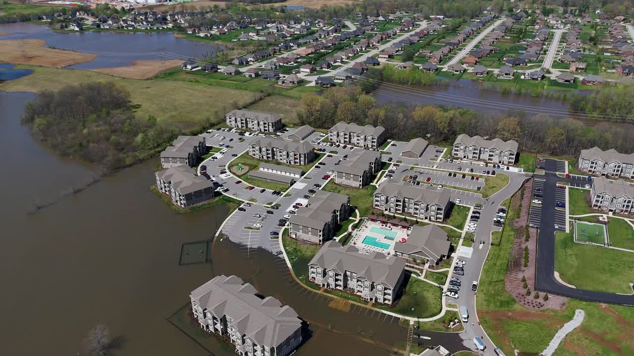 Aerial footage of an apartment complex partially submerged in water after April 2025 flooding in Clarksville, Tennessee