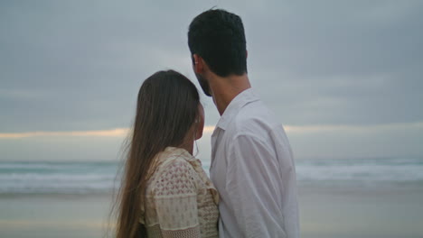 love couple touching hands in marine view. romantic people at ocean vertically