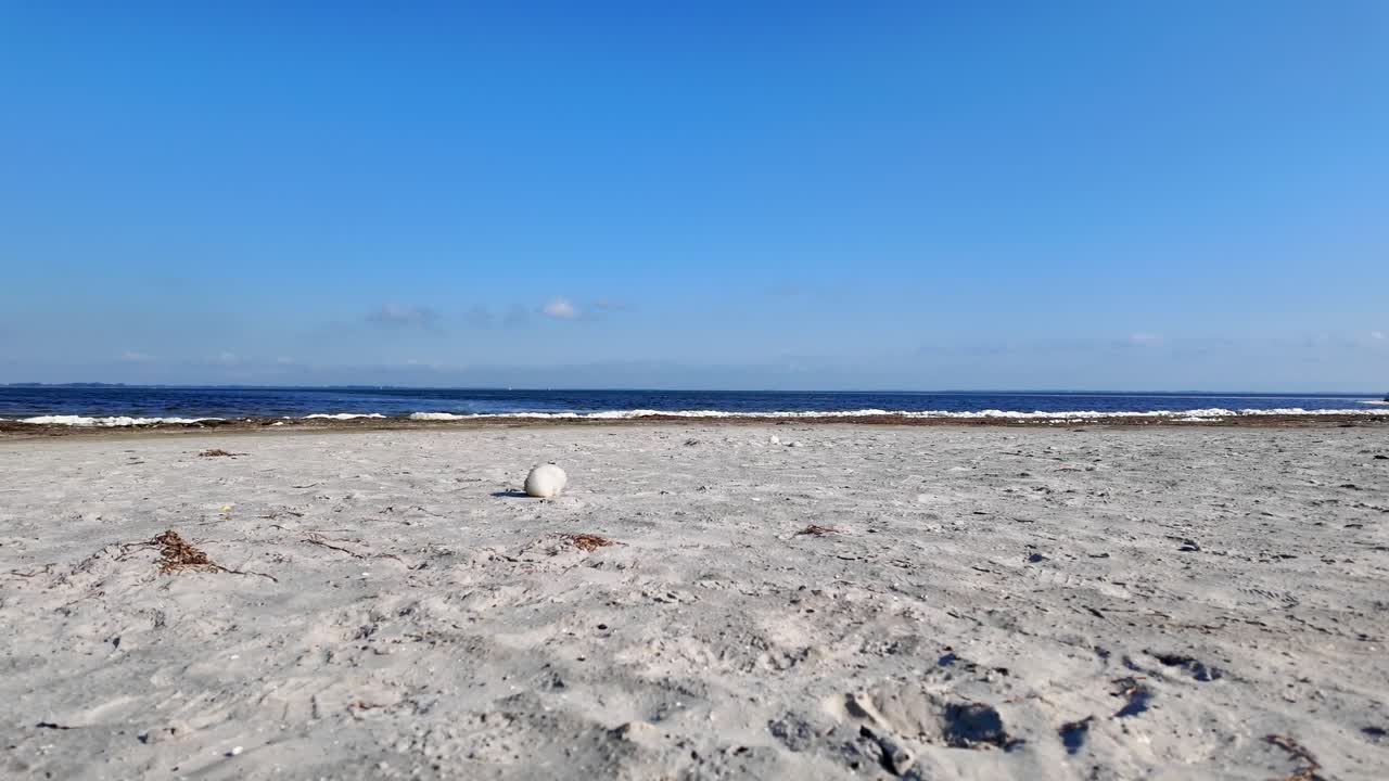 Sea spray blows over the beach 4k 60fps slow motion