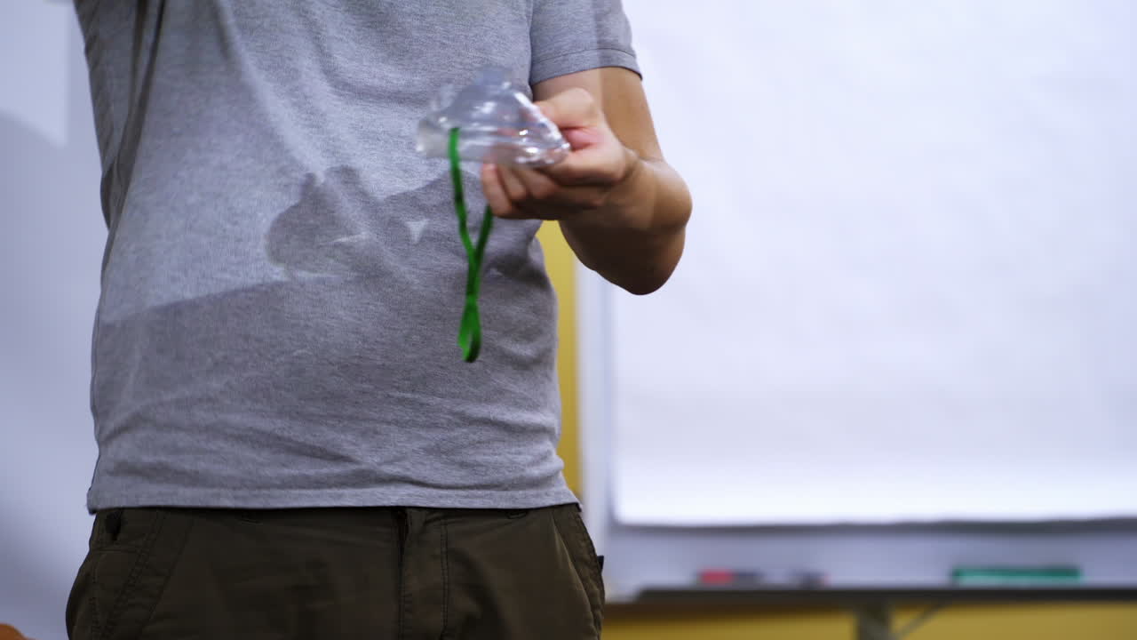 Instructor giving medical advice for resuscitation. Teaching methods of helping people at emergency situations in medical center.