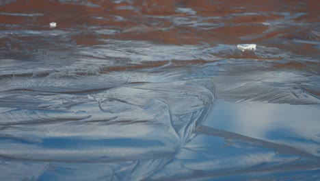 beautiful pattern on the surface of the frozen pond