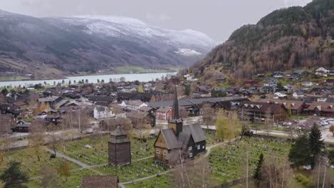 panoramic view on norwegian landscape with vaga church in vagamo, norway - aerial drone shot