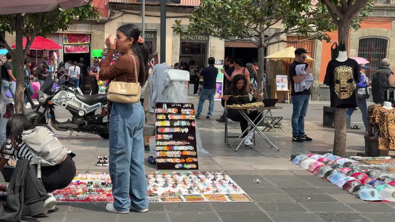 Individuals shopping for items in Mexico City's cultural district