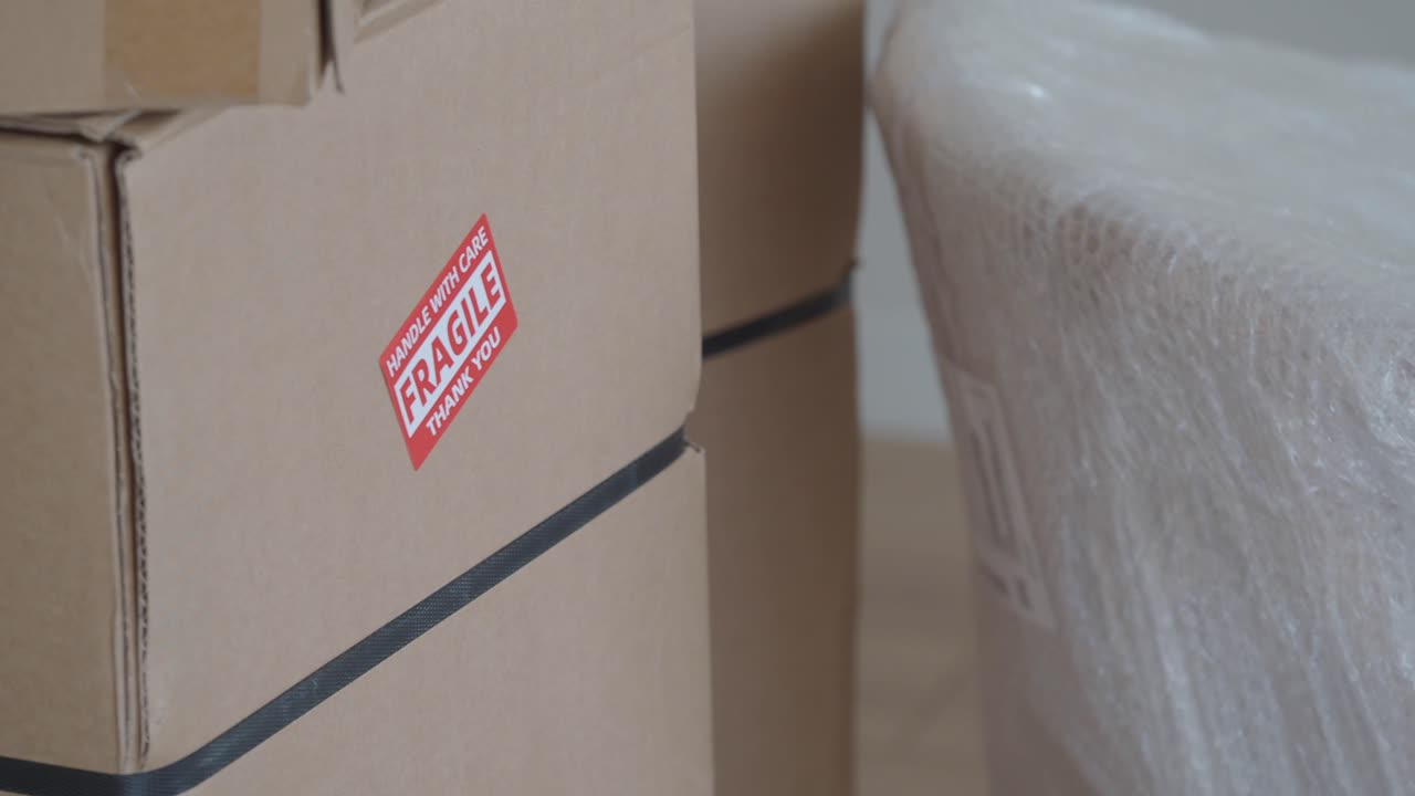 Moving boxes with a fragile label