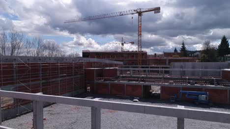 Building-Construction-With-Cranes-Aerial-View