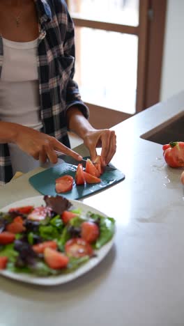 woman preparing a salad in the kitchen