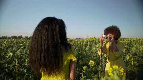 women in a sunflower field