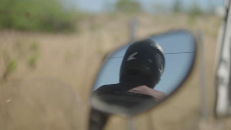 motorcycle rider reflection in mirror