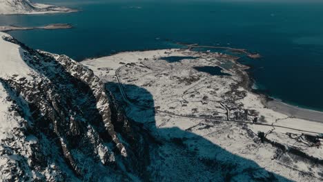 snowscape summit of hoven in gimsoya, lofoten islands, norway. aerial drone shot