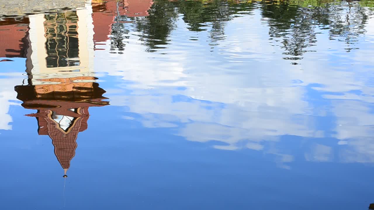 Reflection of the building in water. Reflection shooting