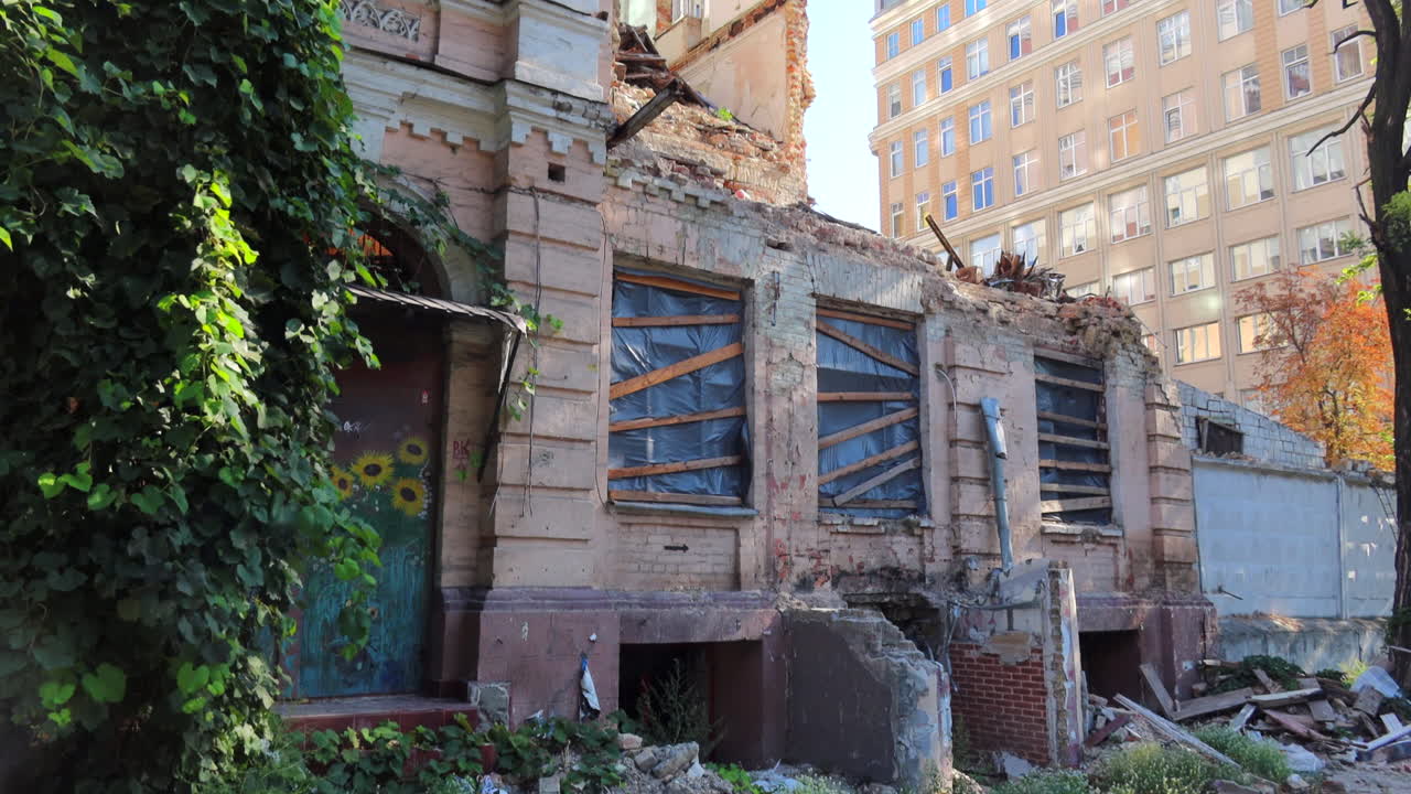 Ruined Building Next to Modern Building