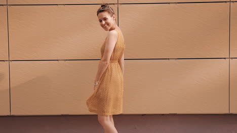 woman in a yellow polka dot dress