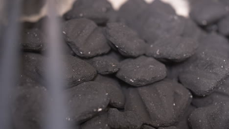 slider move on grilling grates reveals bbq charcoal briquettes in smoker