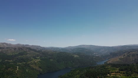 aerial - panoramic view of the river winding through mountains in salamonde, portugal