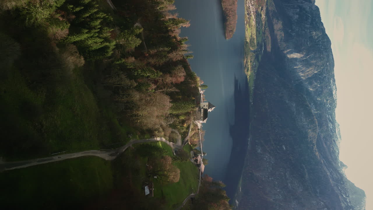 Aerial view of a lake surrounded by mountains and trees