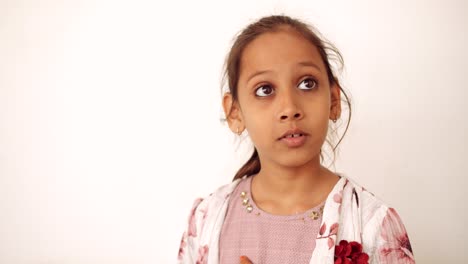 portrait of an indian child at home during coronavirus lockdown