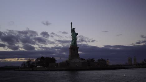 statue of liberty and new york skyline view from ferry