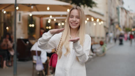 a young woman smiles in the city