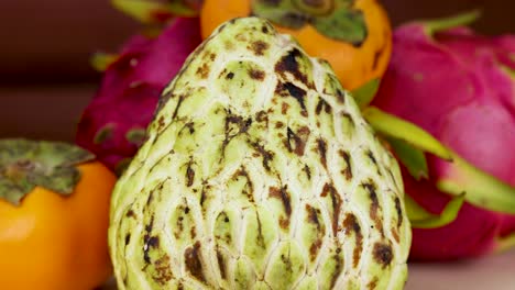 vibrant arrangement of dragon fruit and persimmons