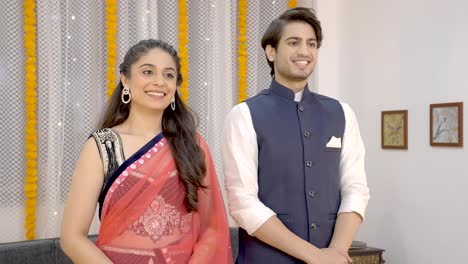 indian couple wishing happy diwali