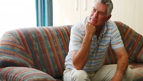 Thoughtful-patient-sitting-on-a-couch