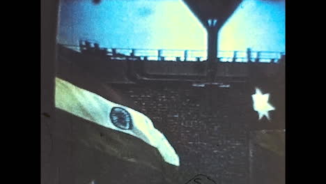 historical event with flags and water tower
