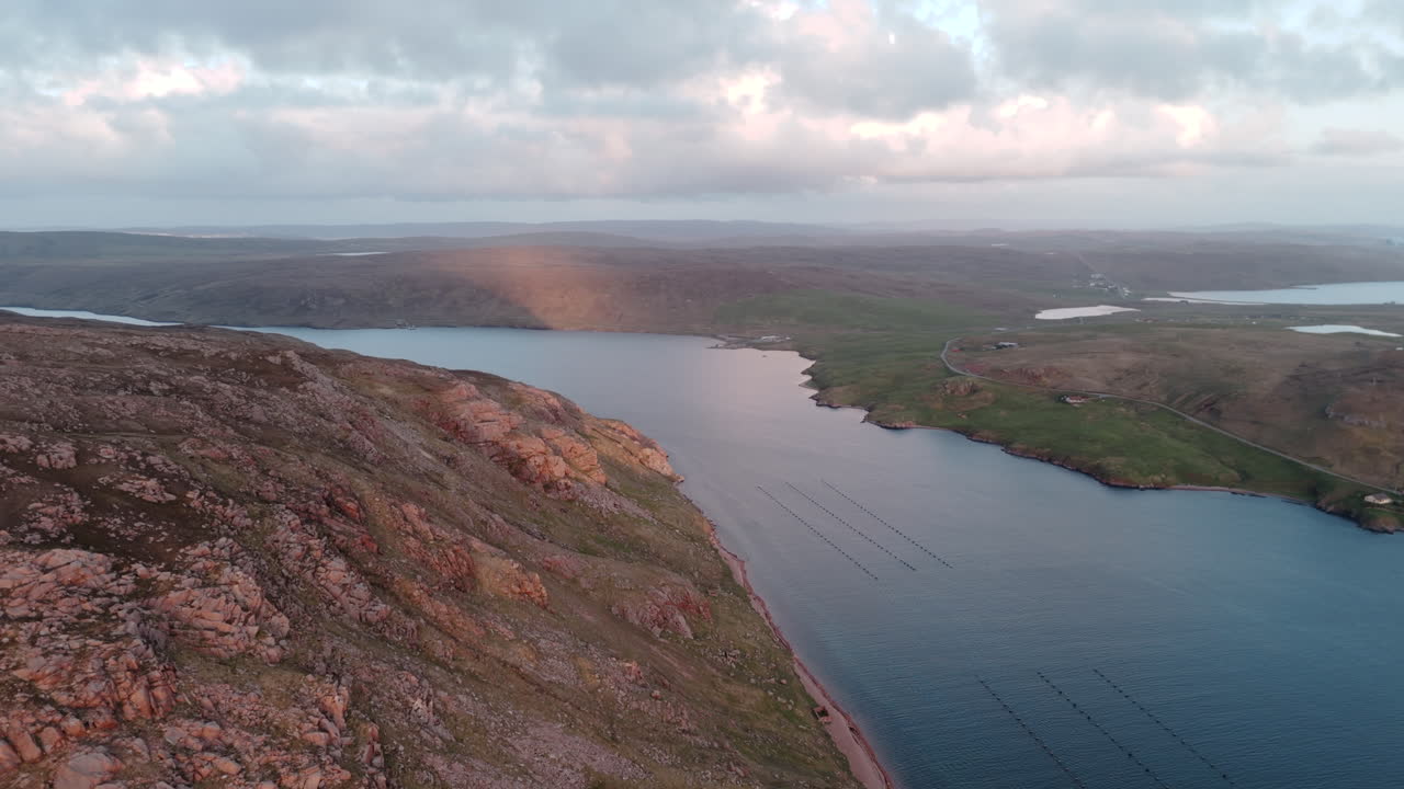 Aerial shot at Ronas hill in Shetland at sunset looking down the sea voe in North Scotland