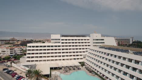 aerial pull away view from holiday destination hotel to the sea in almeria spain