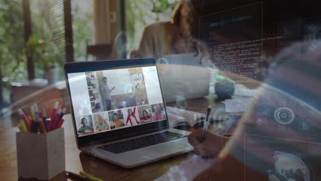 in school, student taking notes during animation class on laptop at home