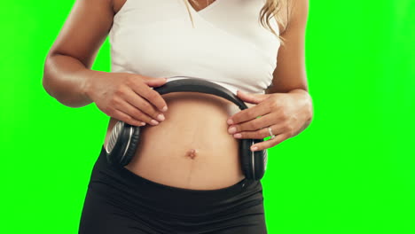 hands, pregnant woman or headphones on belly