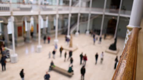 people walking inside the museum atrium