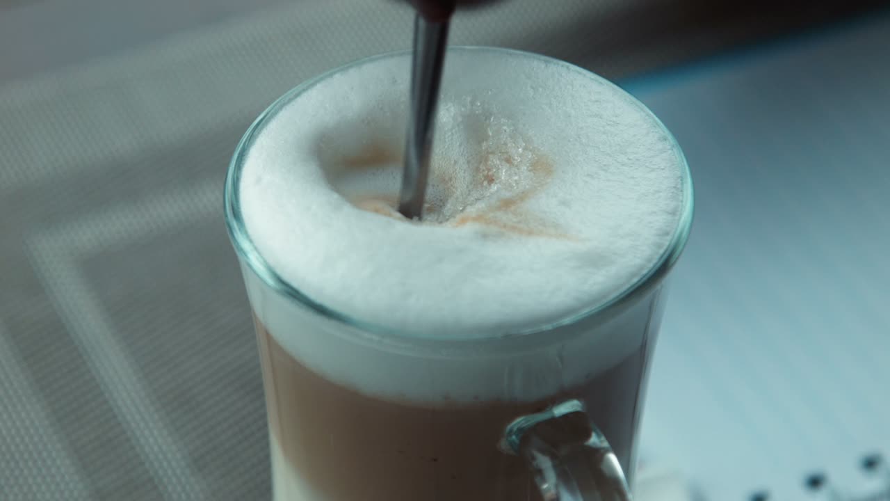 The Girl Fills Sugar In Coffee And Stirs