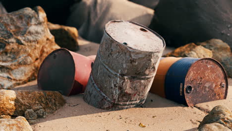 old oil barrell on the sand beach