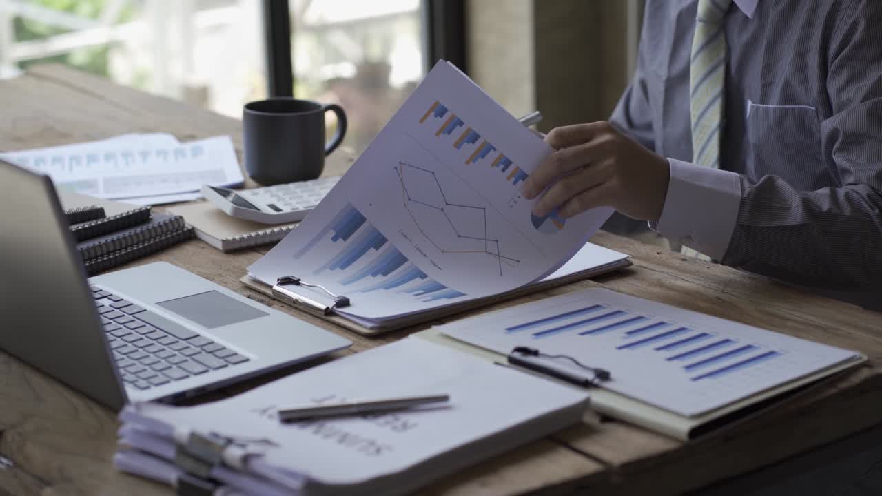 Business people develop business projects and analyze market data working in the office with business reports and stock analysis documents. paperwork concept