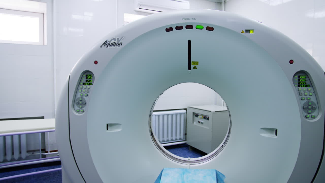 Advanced equipment for magnetic resonance scanning. Spacious hospital room with no people.