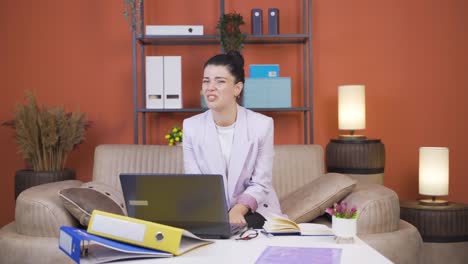 home office worker young woman looking at camera with disgust and hatred.