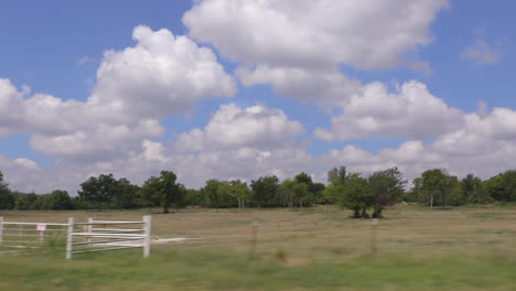 driving shot of the sky over a midwest country field.