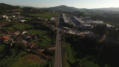 Traveling-Down-Country-Road-Rural-Landscape-Aerial-View