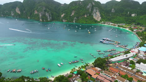 Boats-Floating-On-the-Coast-Of-Phi-Phi-Islands-With-Turquoise-Blue-Sea-In-Thailand