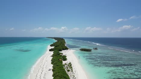 aerial above long lush sanbar amid vast blue lagoon on dhigurah island, maldives