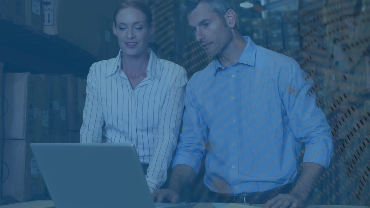 Animation of digital icons over businesswoman using laptop