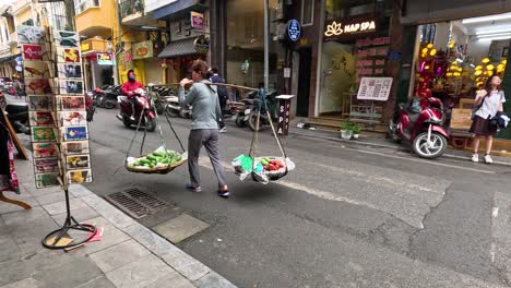 hawker walking with a shoulder pole and baskets