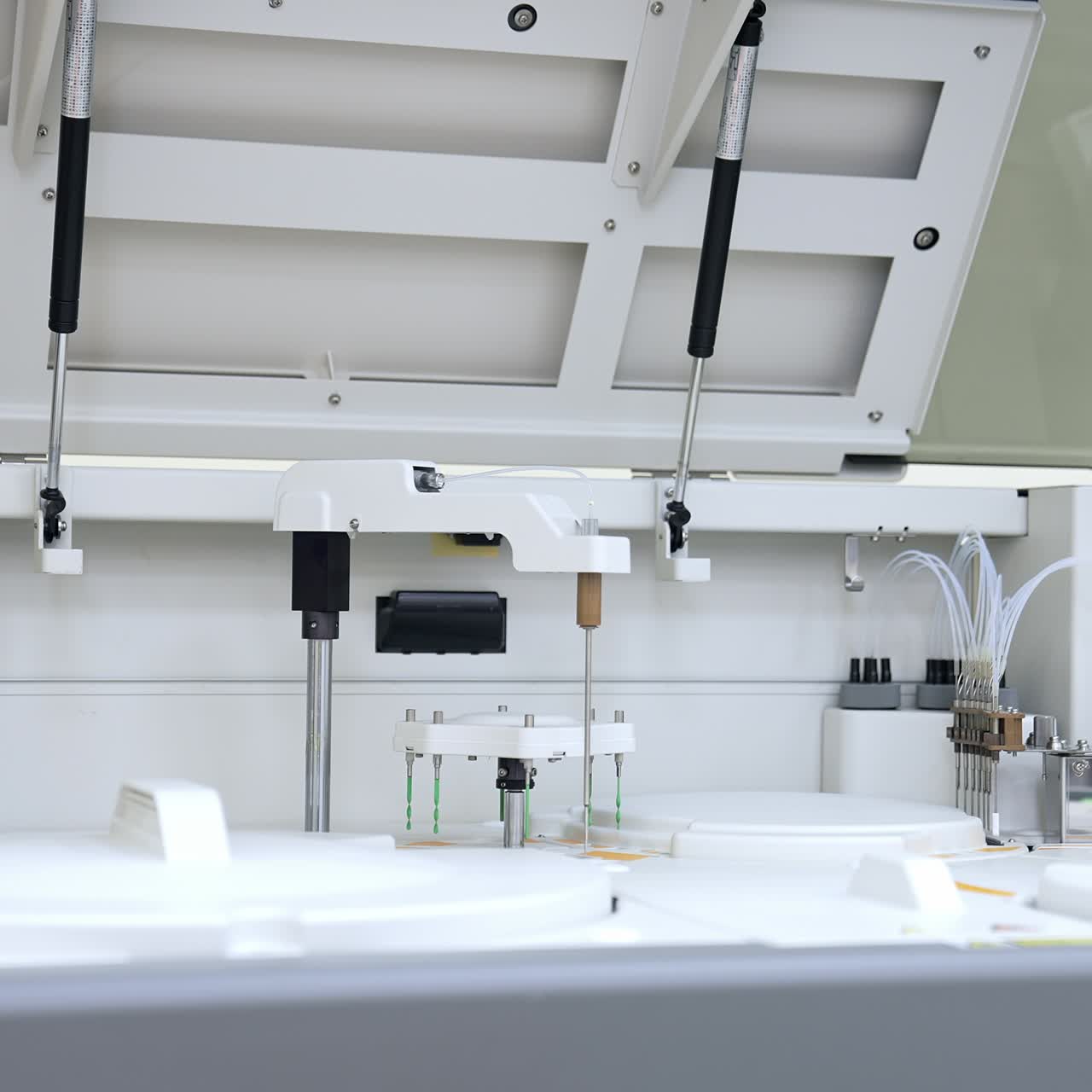 Large laboratory machine working and producing biomedical testing of blood. Advanced innovative equipment in science lab