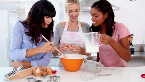 three friends home baking together