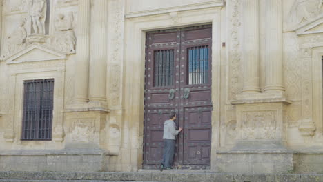 adult woman walks to entrance door old city hall jerez de la frontera