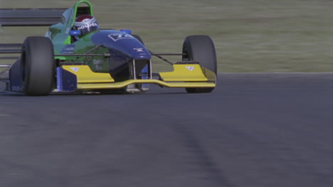 formula car drives on a circuit track 1