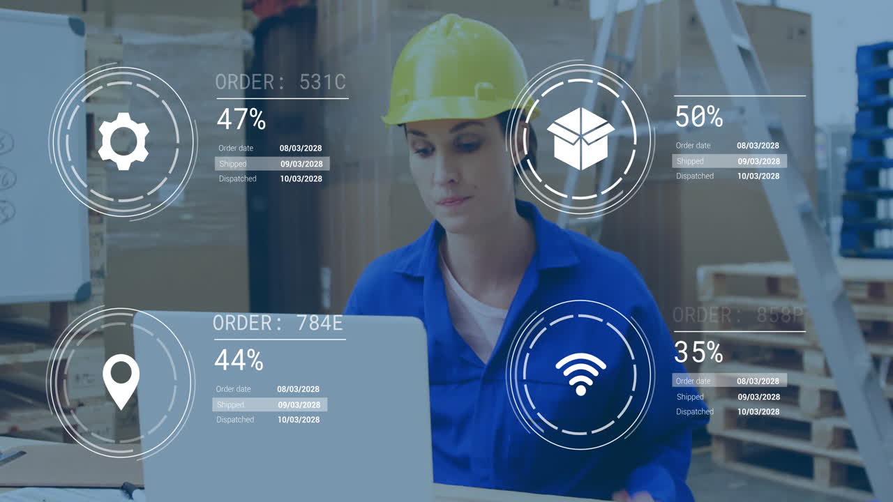 Using laptop with digital animation overlay, warehouse worker in blue uniform