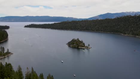 a 4k drone shot of fannette island, lying in the middle of emerald bay, a national natural landmark located along the california side of lake tahoe