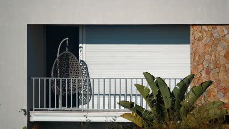 sunny balcony with swing chair in portugal