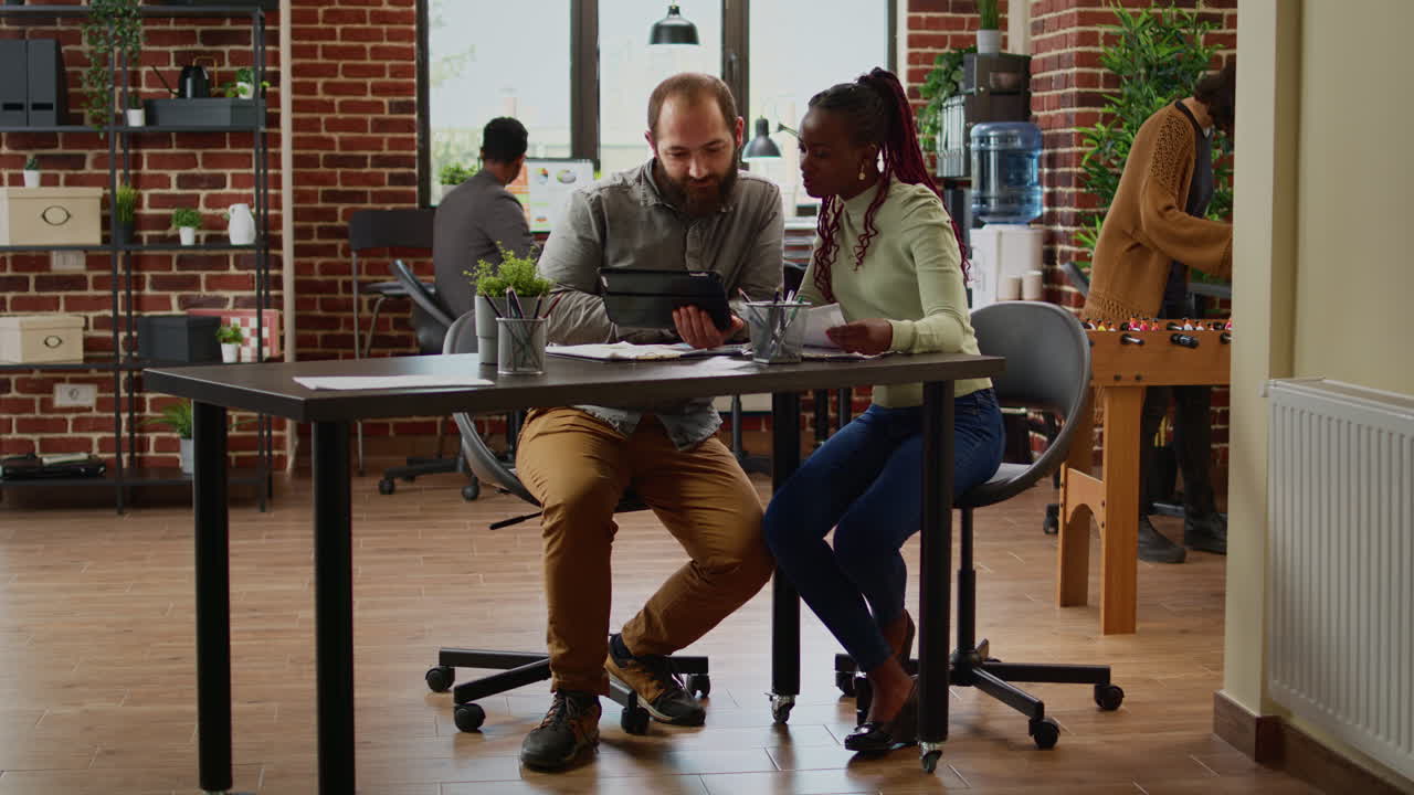 Diverse team of people working on business report in company office